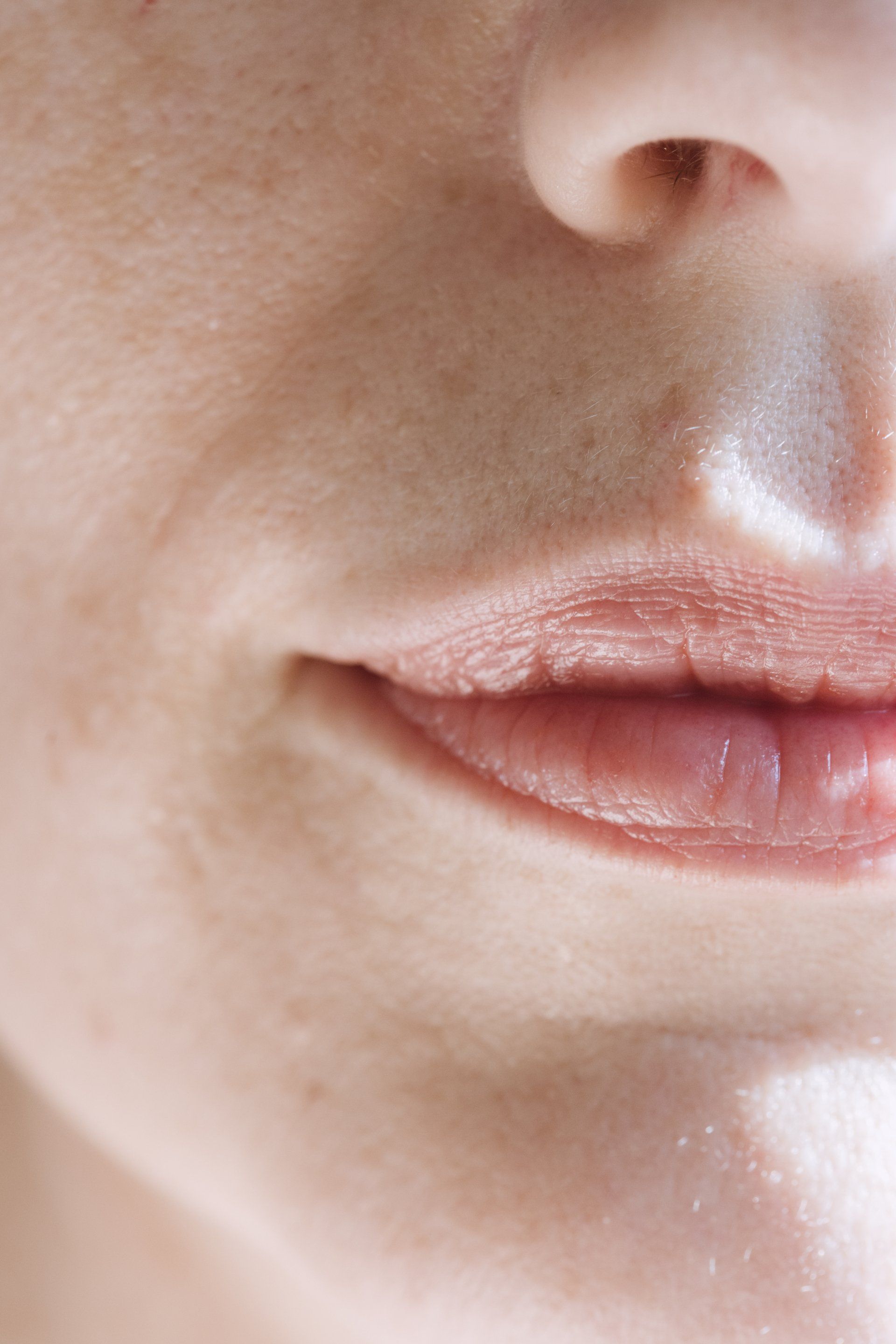 a close up of a woman 's mouth and nose