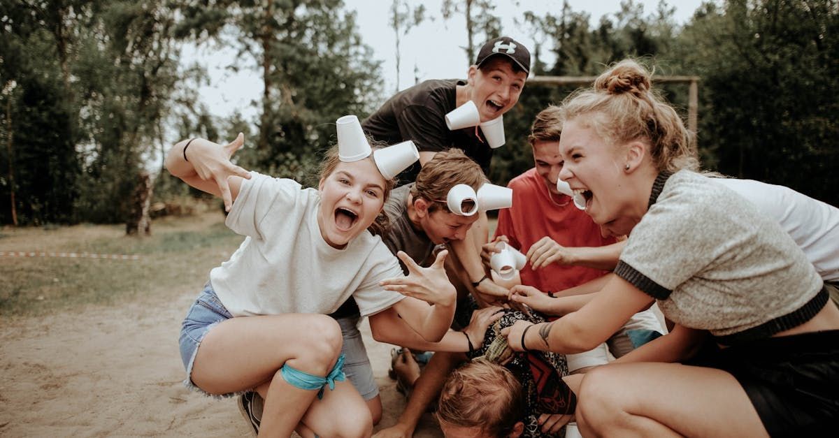 A group of young people are playing a game in a park.