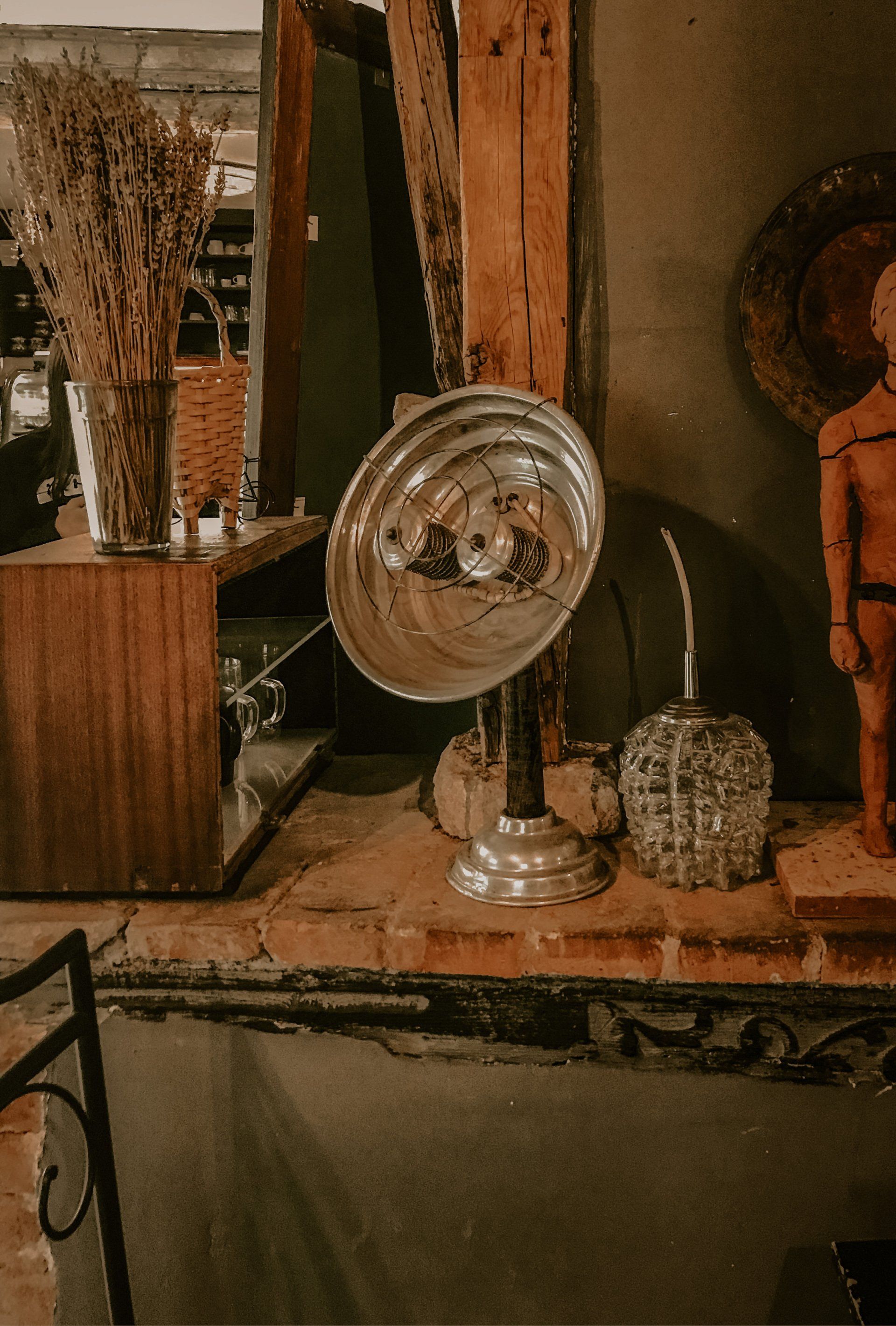 A picture of an old round space heater.