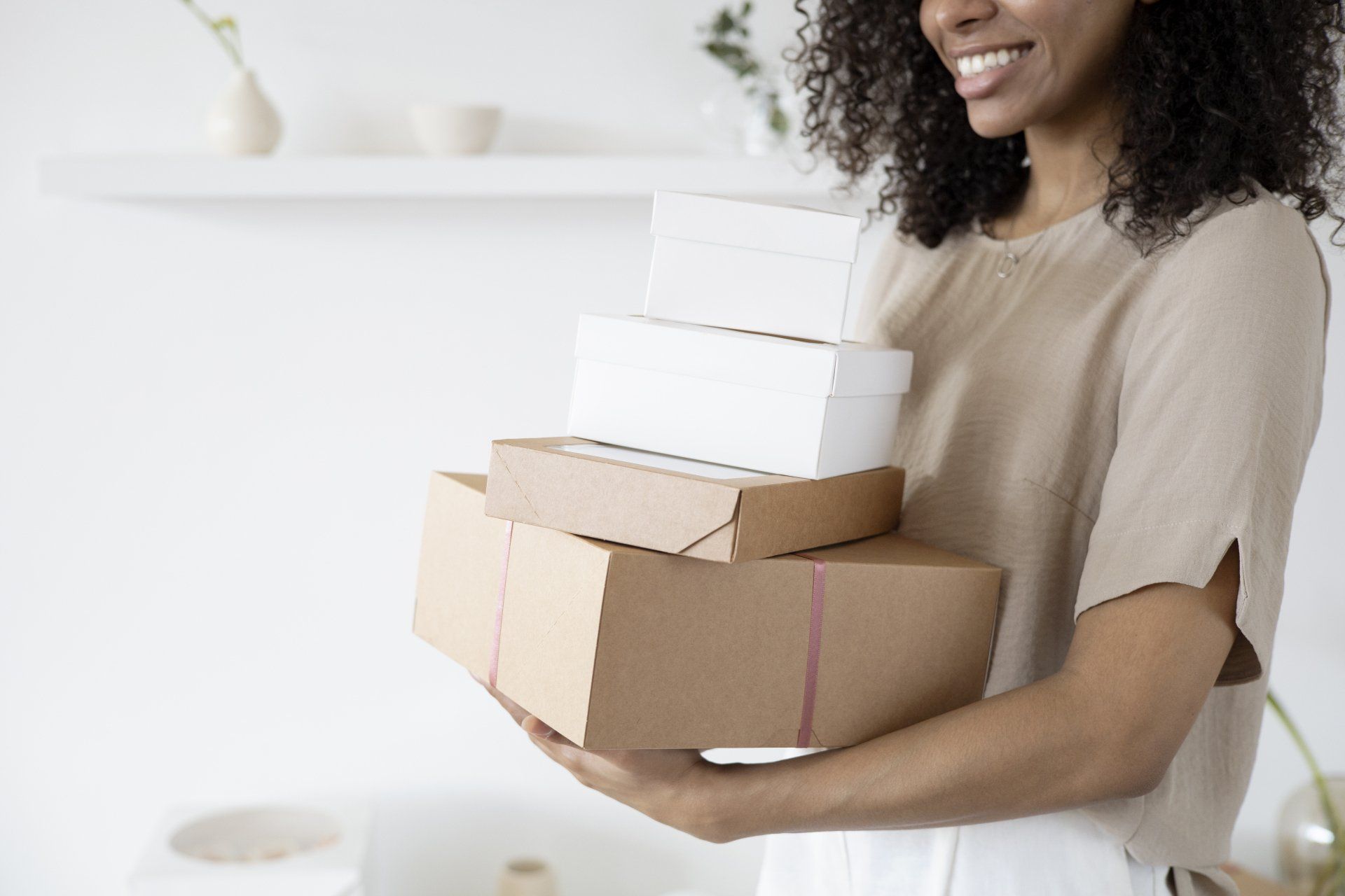 Woman with boxes of printed documents for courier delivery