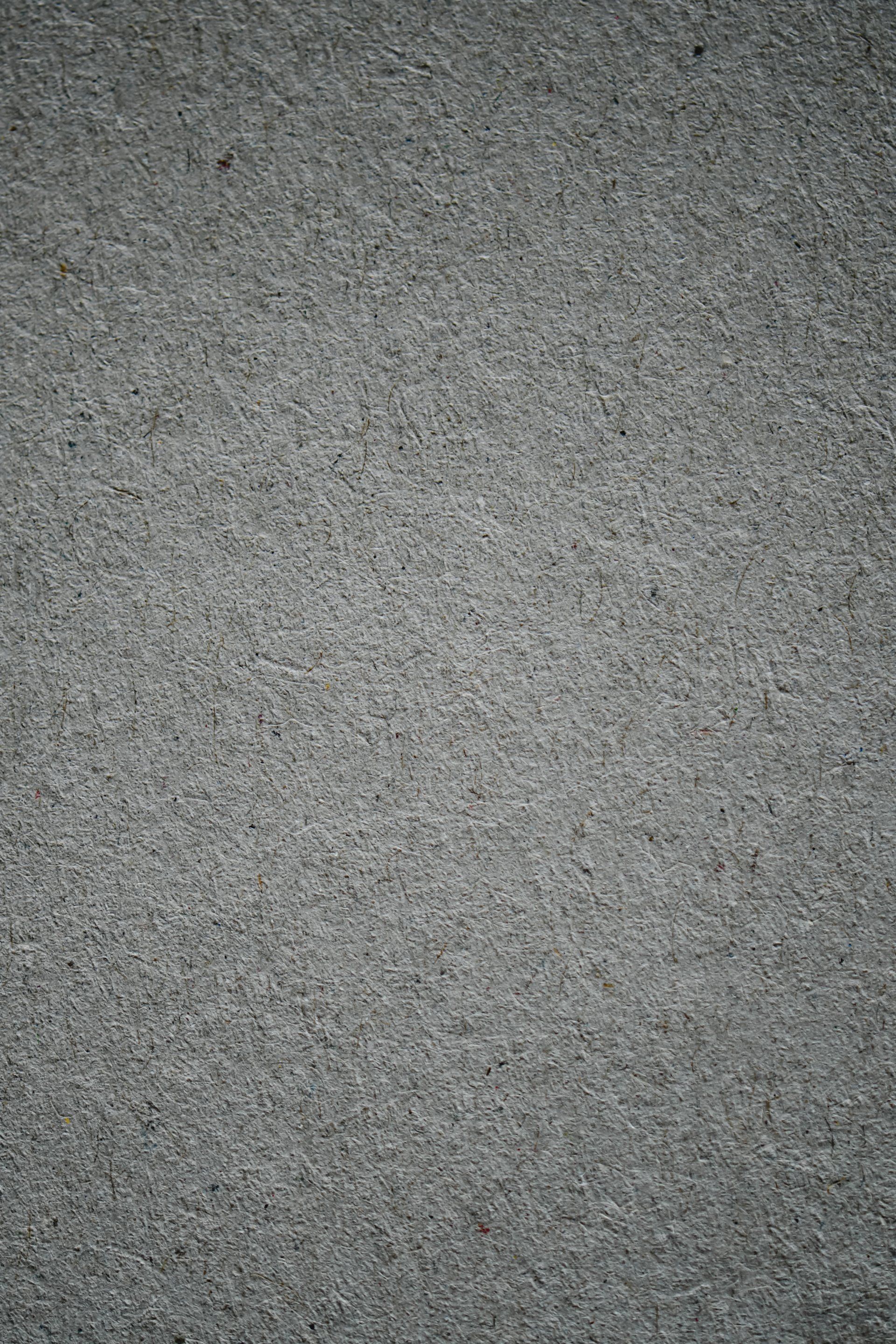 A close up of a gray carpet texture.