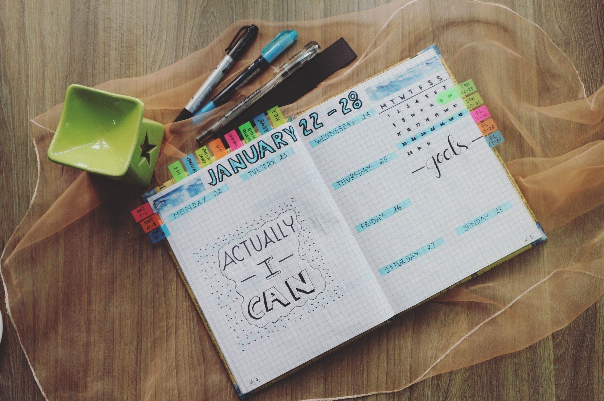 A calendar open to a page that says, Actually I can.