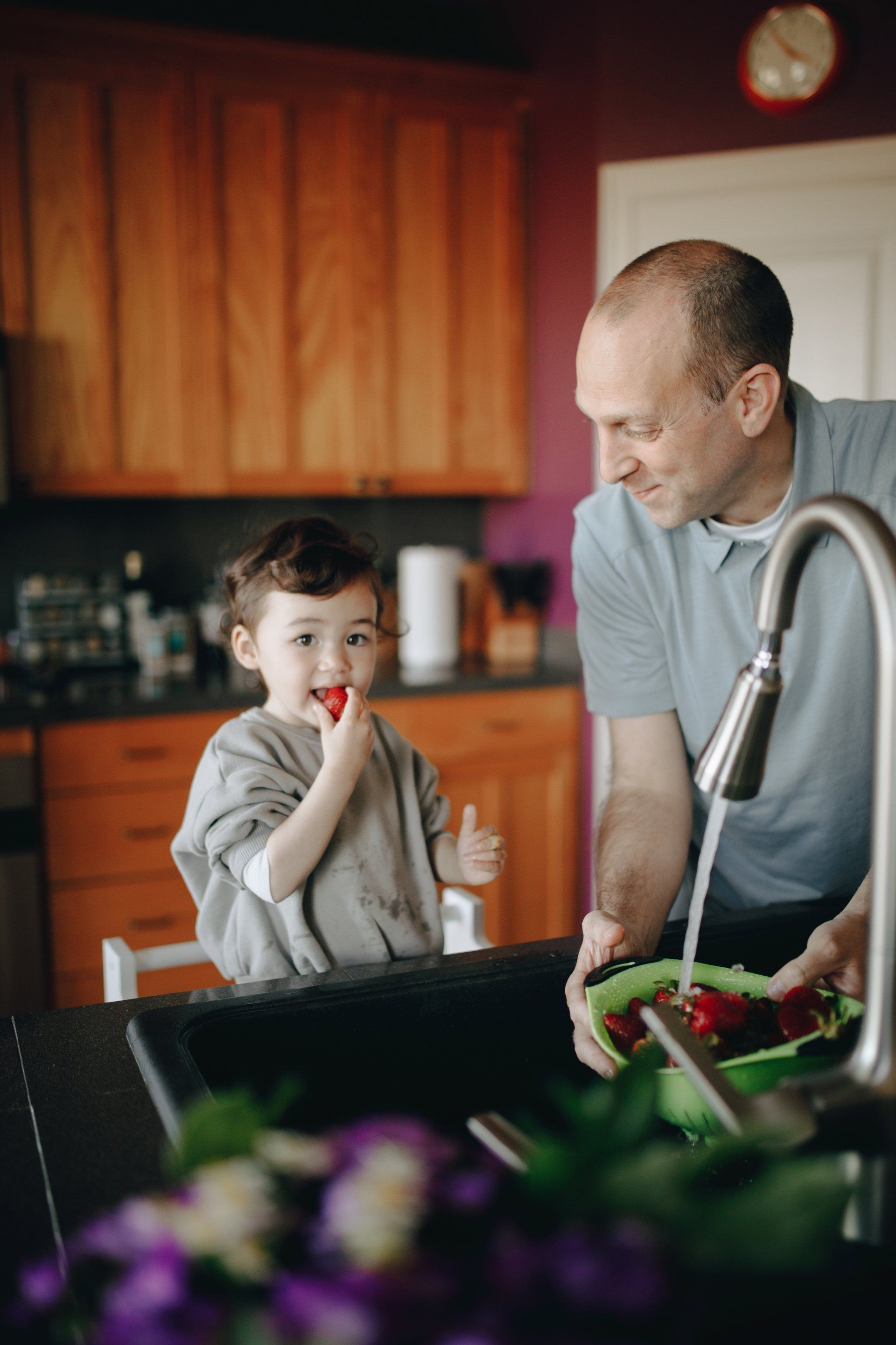 Child and Father Washing Berries