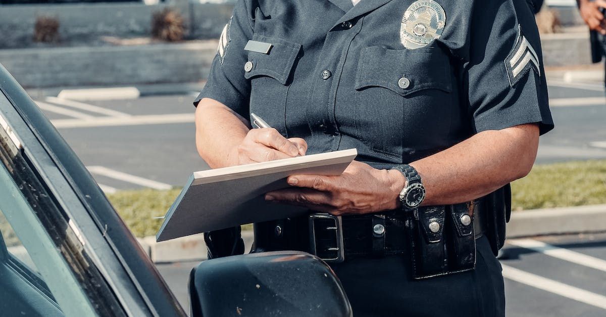 a police officer is writing on a speeding ticket. Attorney Ernesto Gonzalez in Orlando FL. Article on types of accidents and how to avoid them.