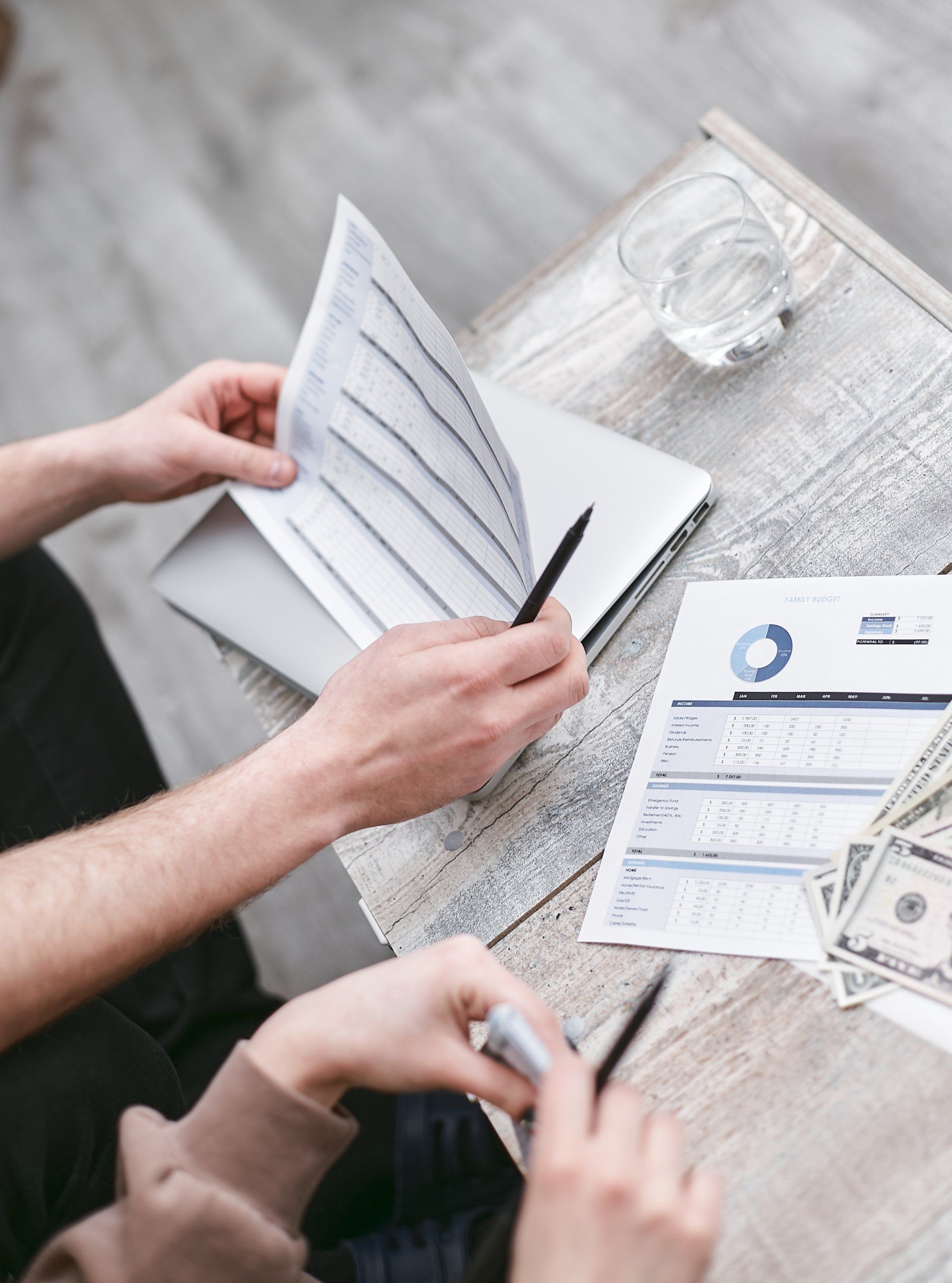 image of person reviewing financial reports
