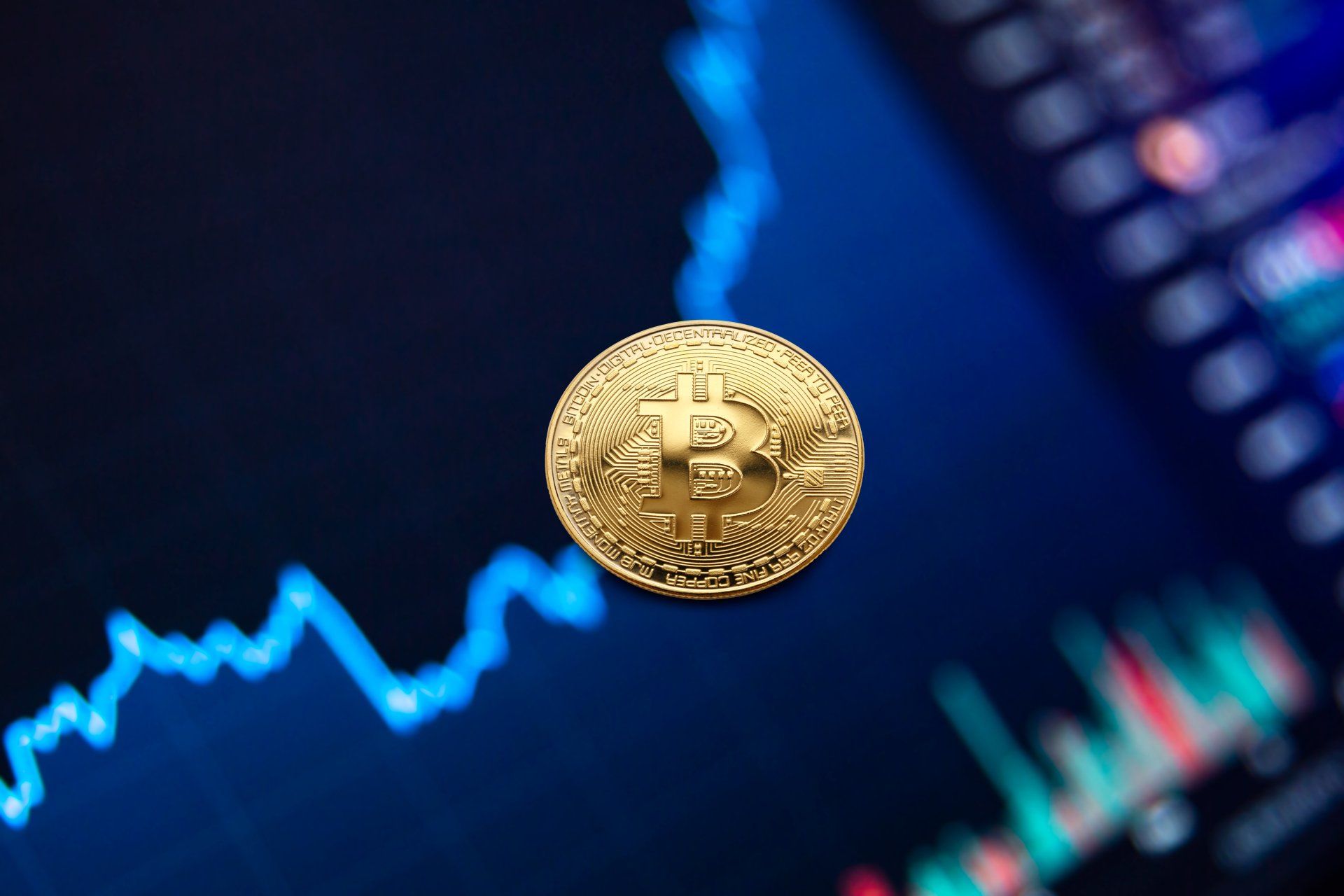A gold coin floating with a stock exchange screen background