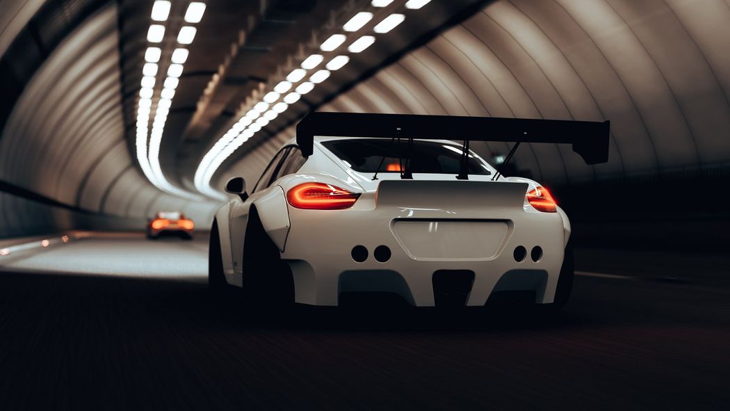 A bright yellow Chevrolet Camaro with black racing stripes and custom alloy wheels, angled against a white background.