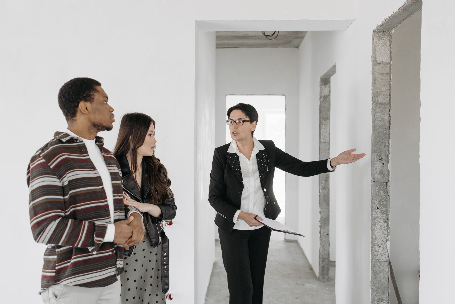 A man and a woman are looking to rent a home