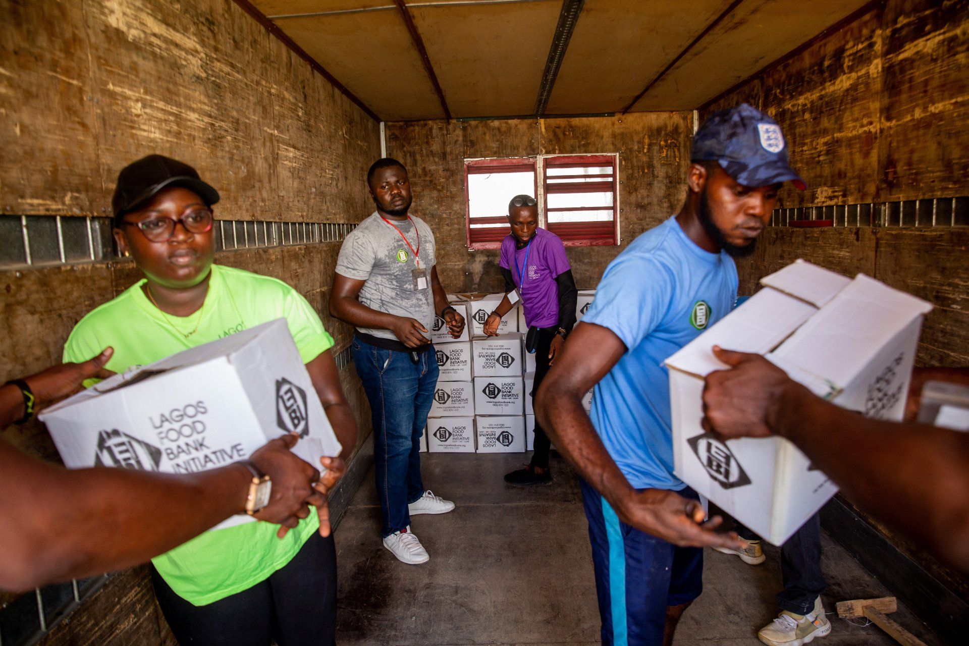 people delivering supplies in poverty area