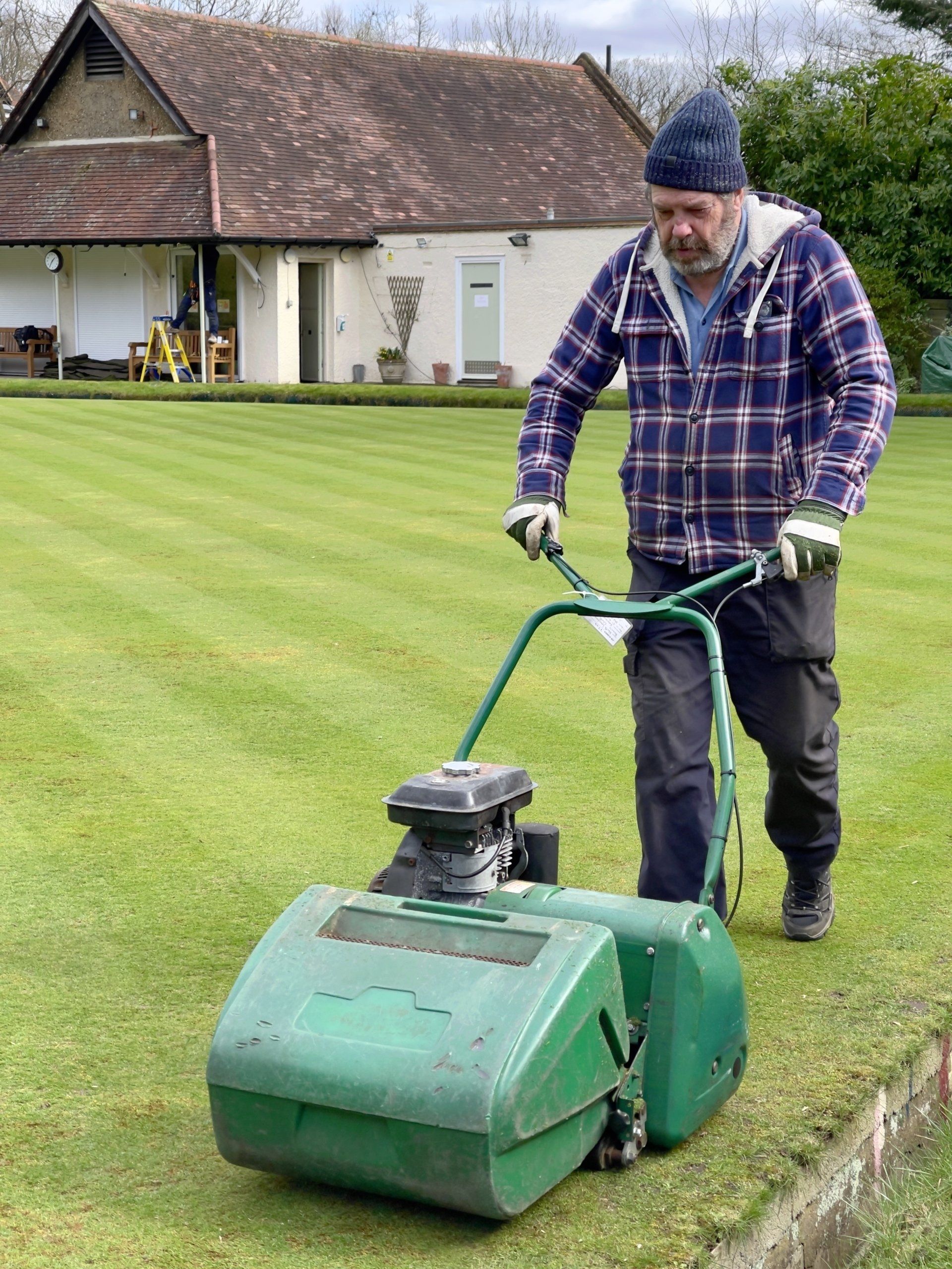 a man mowing the lawn