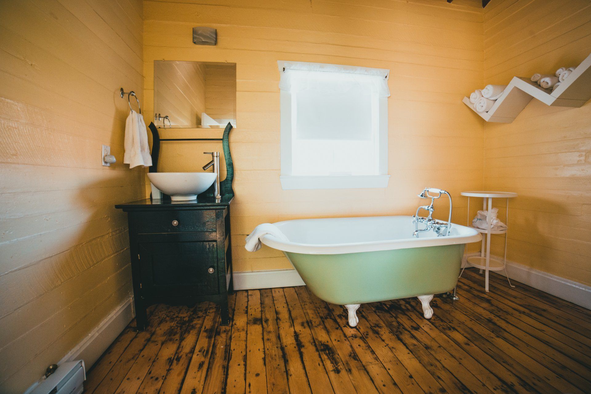 This image is an old clawfoot bathtub that has been refinished and became a part of this bathroom remodel.