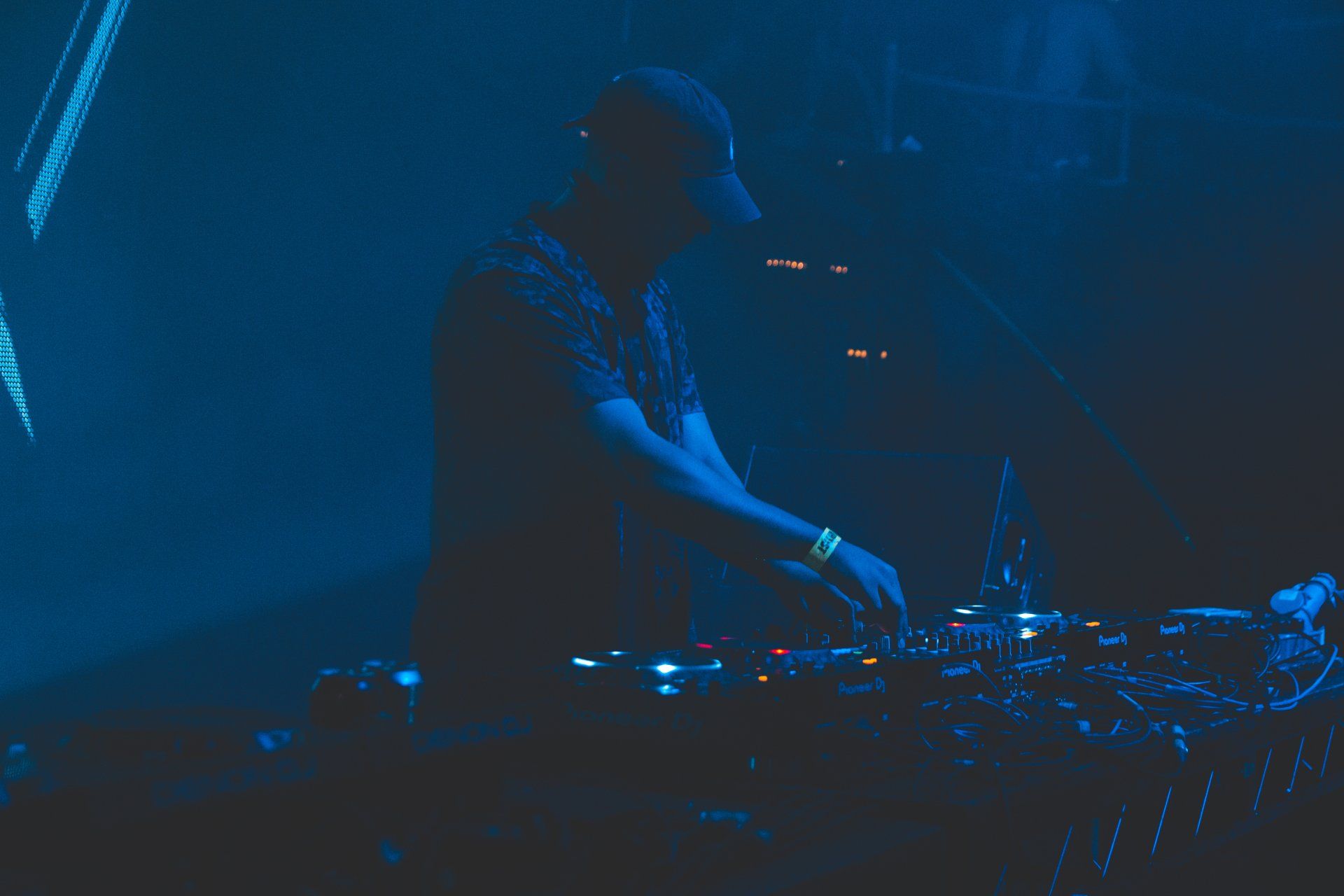 Famous electronic music artists performing live with their signature styles.