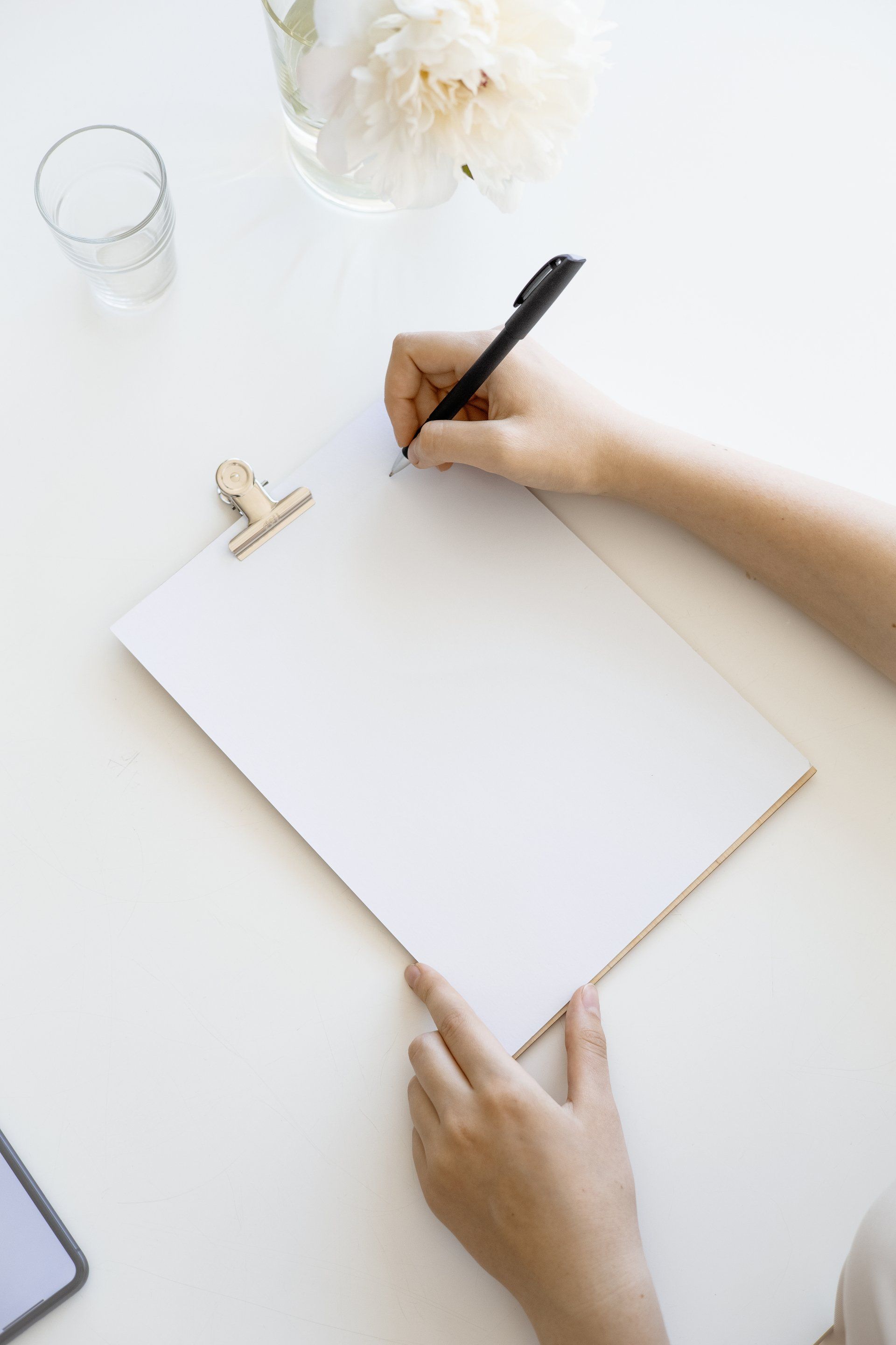 a clipboard with a pen.