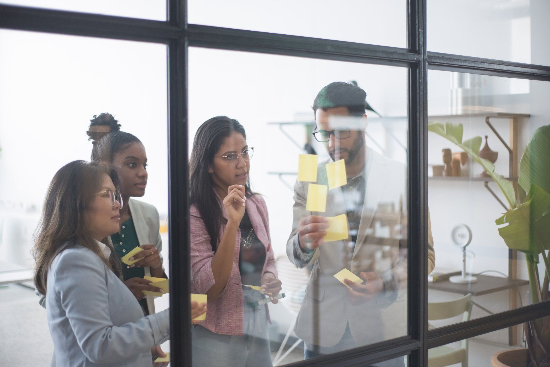 People standing around post it notes