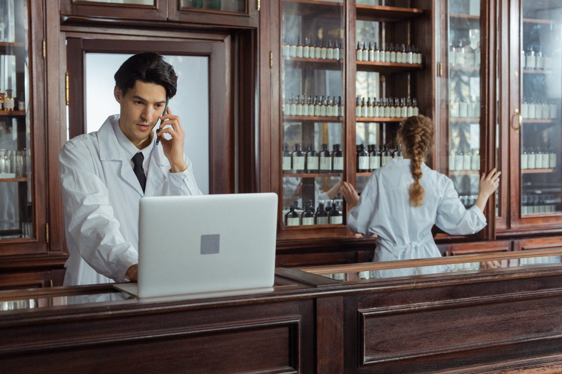 Pharmacist calling a patient
