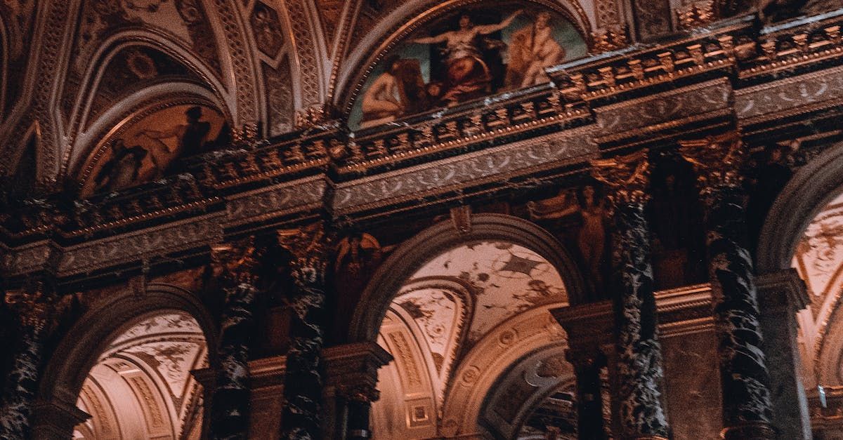 A close up of a building with arches and columns.