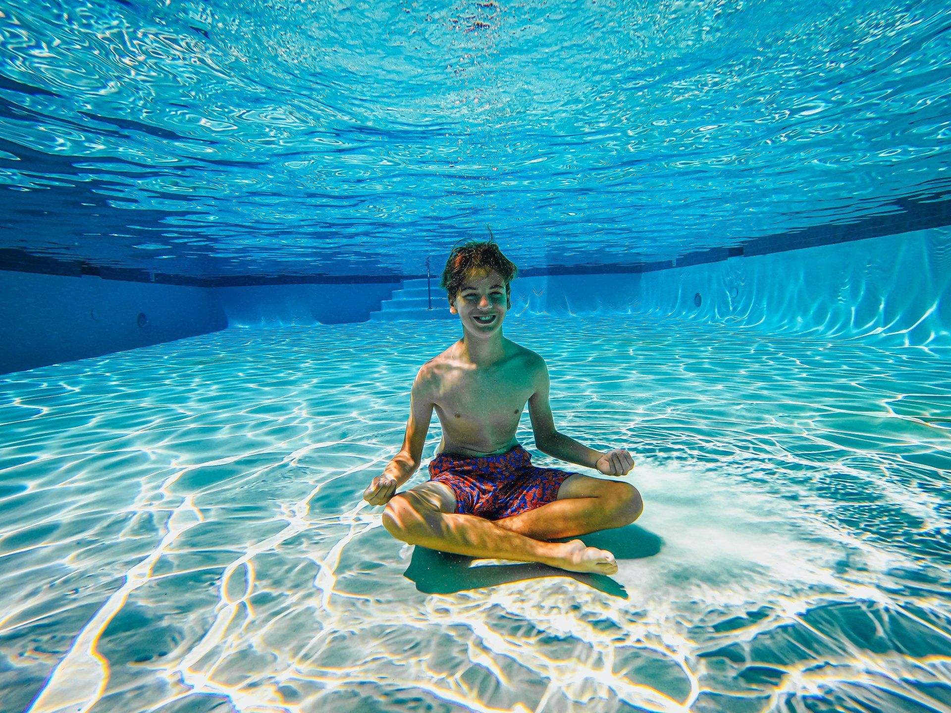 Norfolk kid confidently and safely in pool during swim lessons