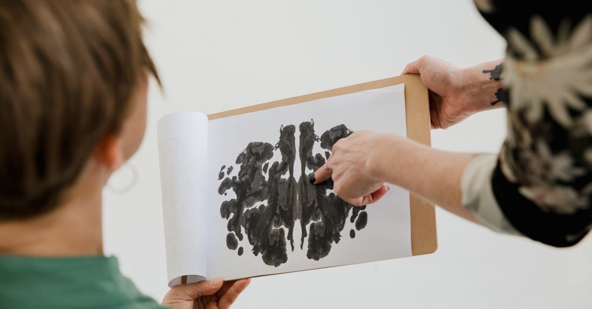 Designer presenting abstract artwork or material sample during a creative design review

