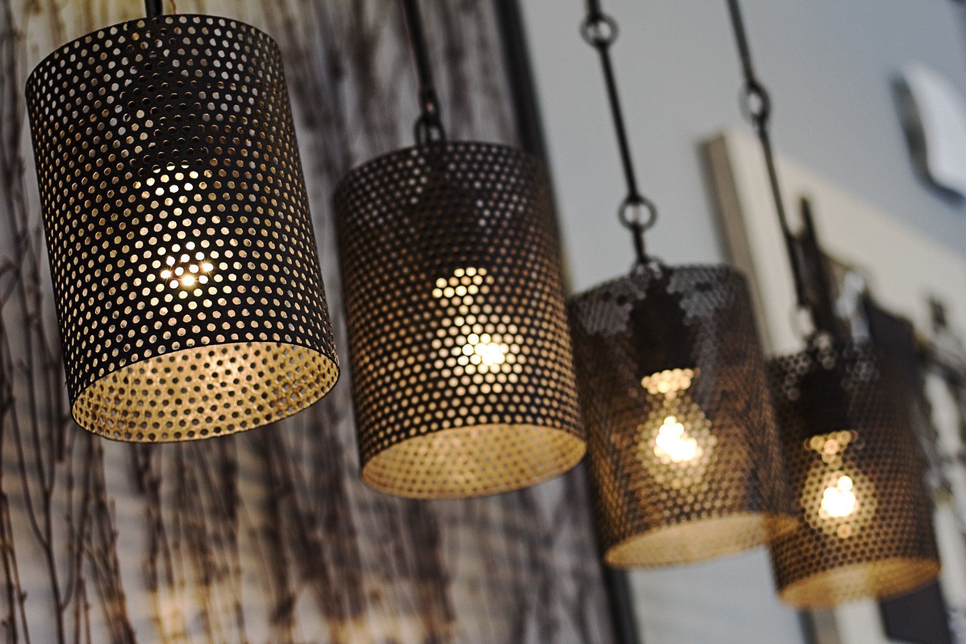 a person is changing a light bulb on a chandelier