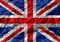 De Britse vlag (Union Jack) wordt hier gepresenteerd met een verfrommeld, gestructureerd uiterlijk.