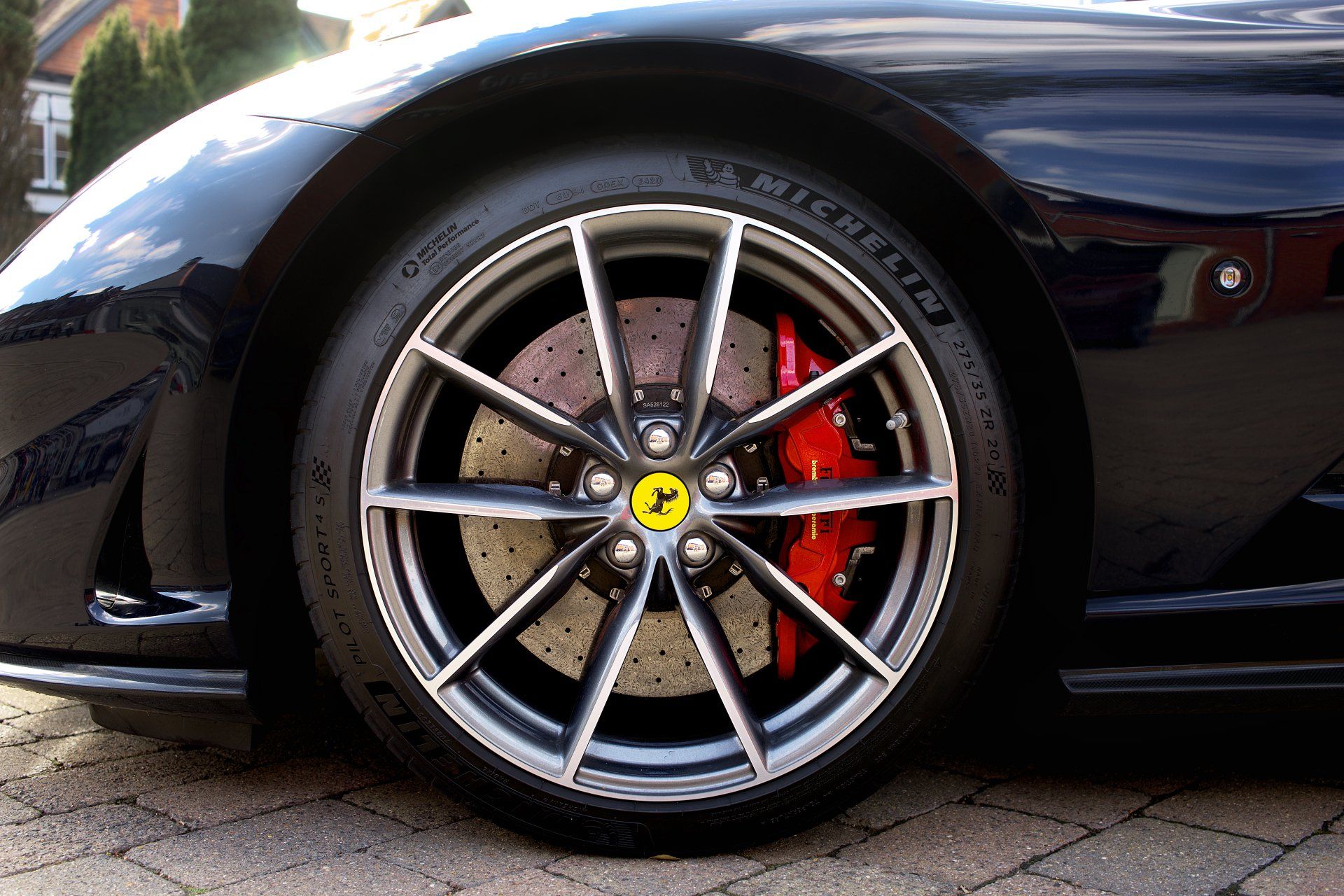 A black car with a michelin tire on it