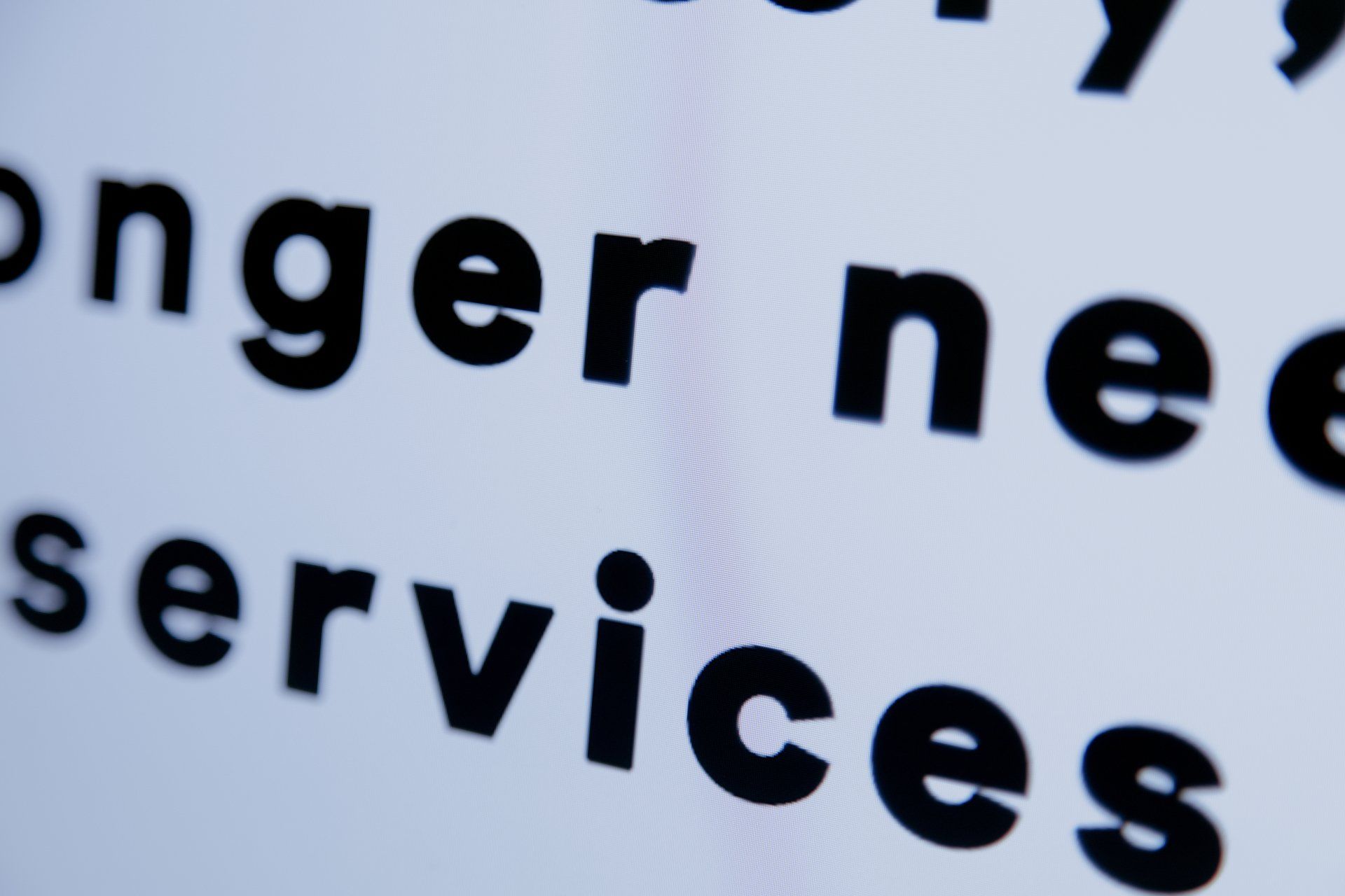 The word services is written in black on a white background