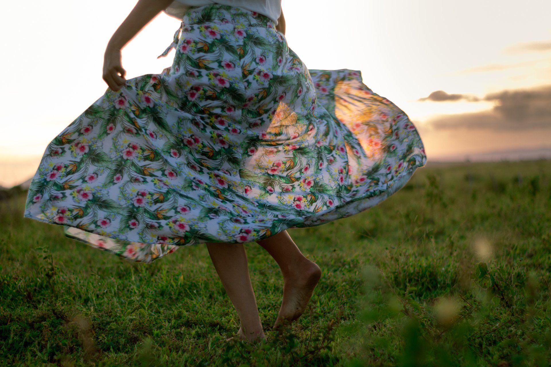 Woman in dress dancing free outdoors