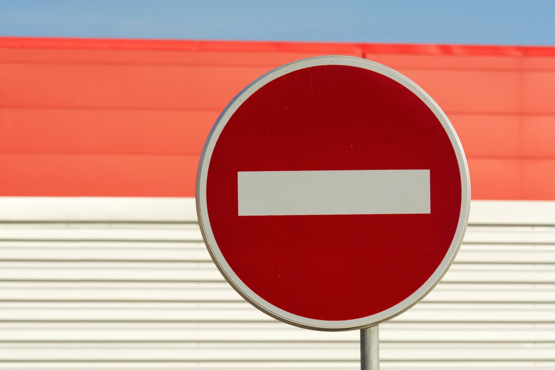 Red circle with white horizontal bar, no entry sign.