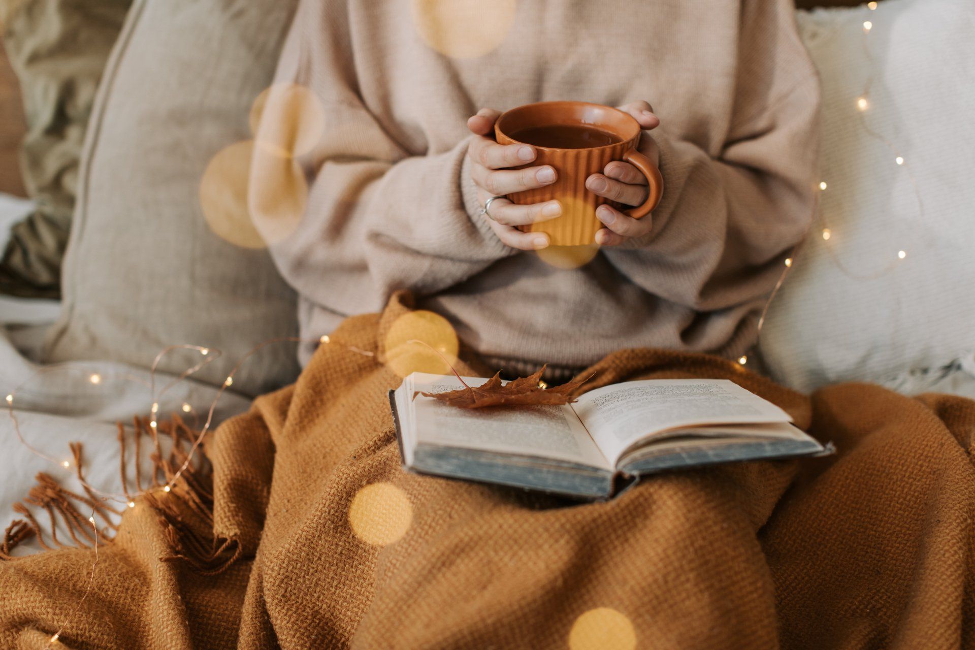 a person having a warm cup of drink