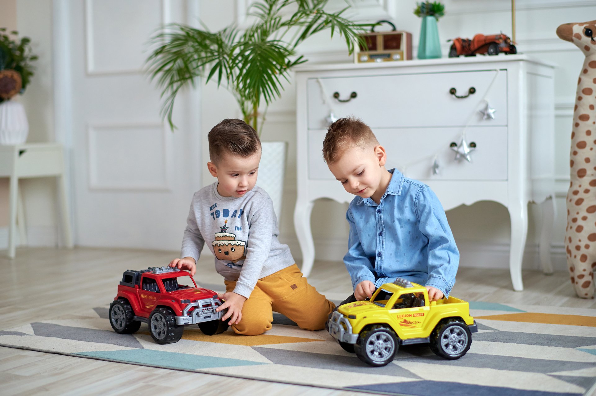 A baby is sitting in front of a bunch of toys
