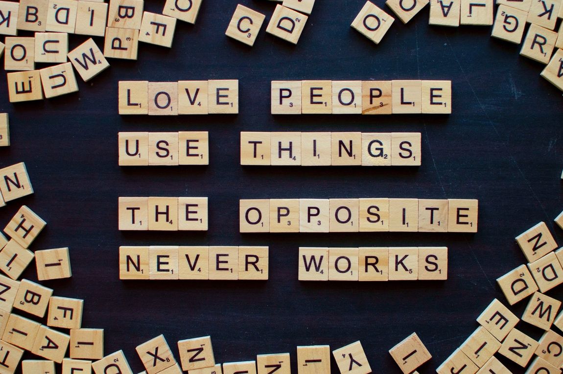 scrabble tiles that say love people use things the opposite never works