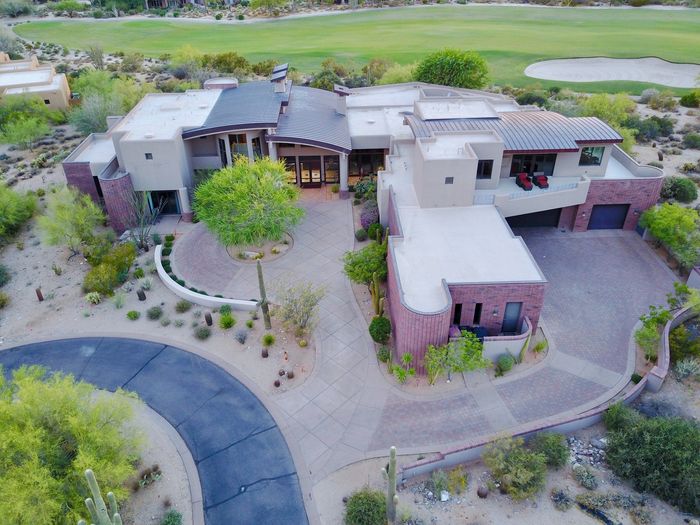 luxury home with stamped concrete driveway