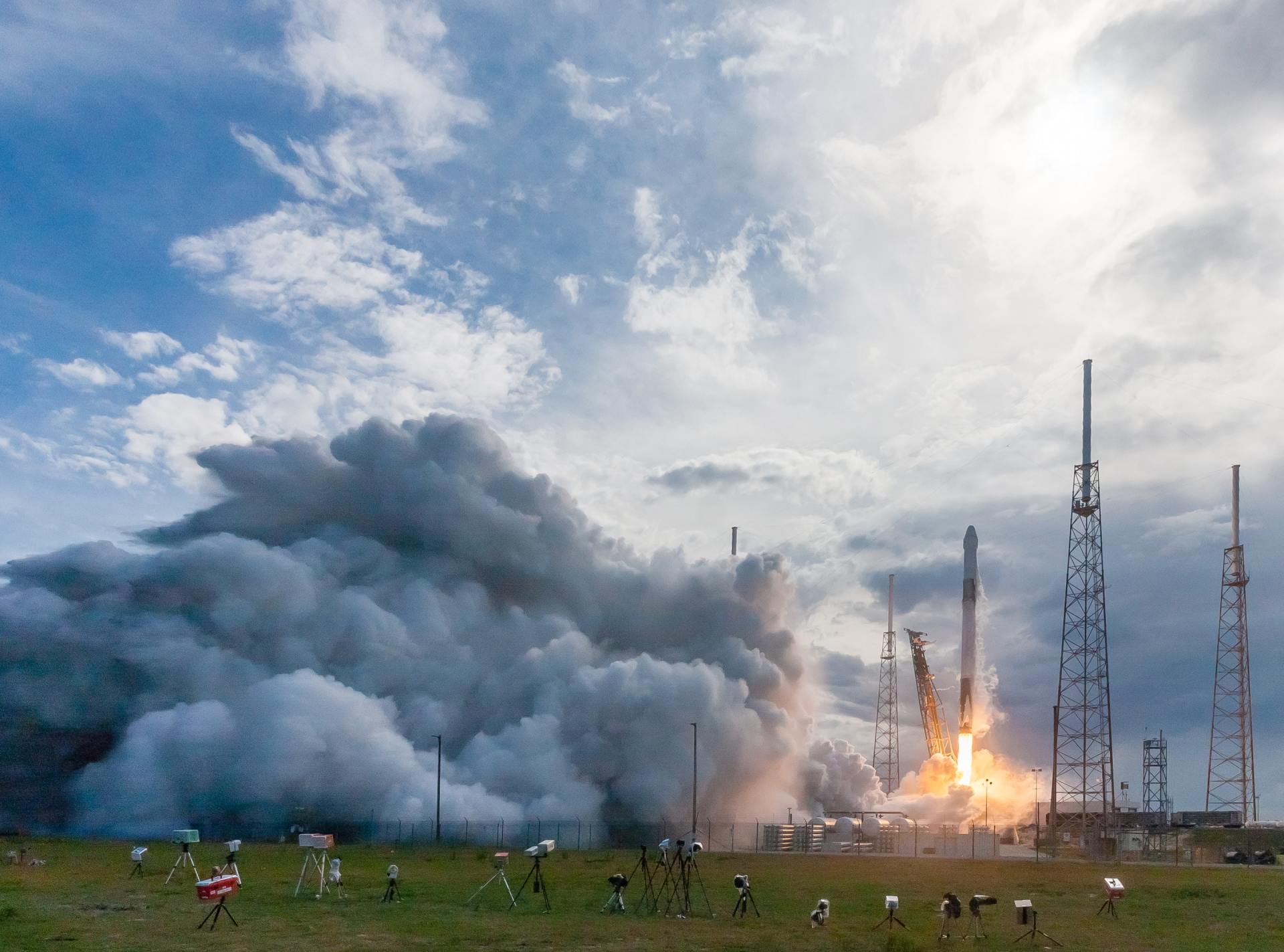 A rocket is being launched into space with smoke coming out of it.