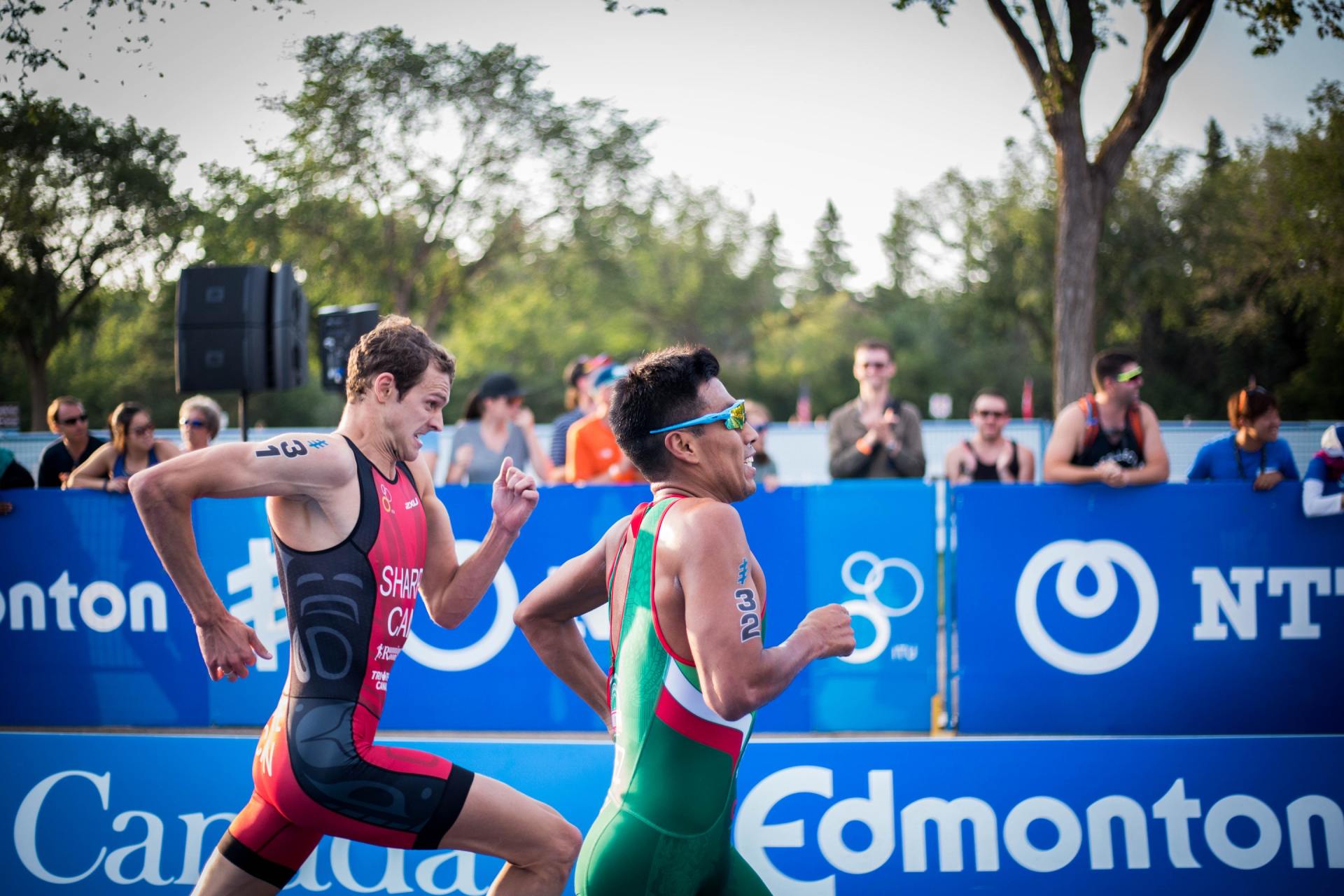 Two men are running in a triathlon.