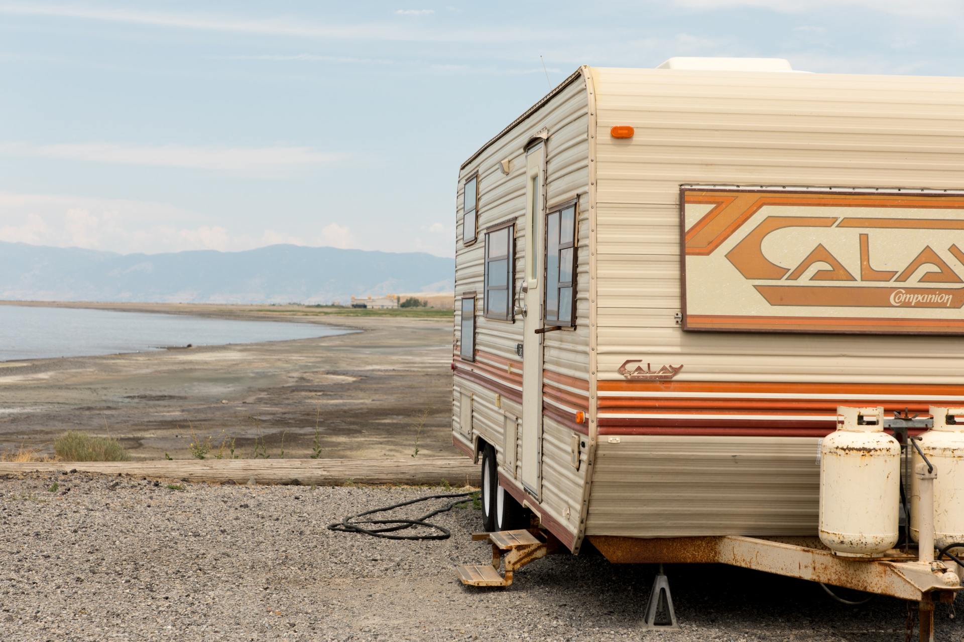A Orange & White Calay 5th Wheeler