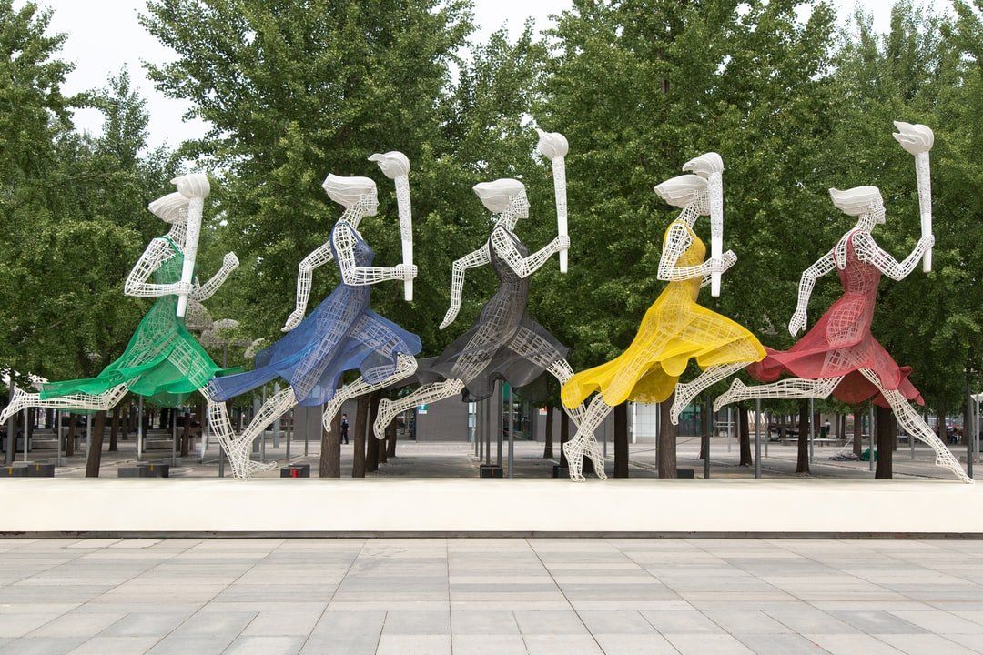 A sculpture of five Olympic torch runners.