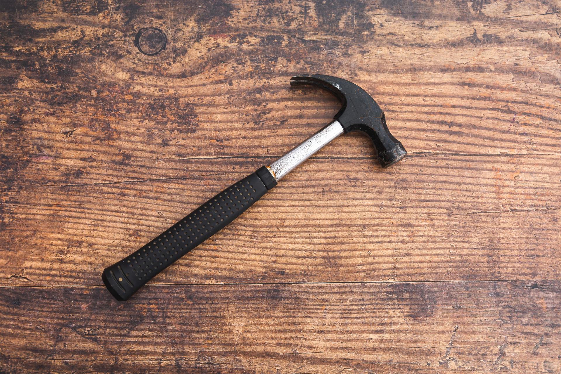 black hammer on a wooden table