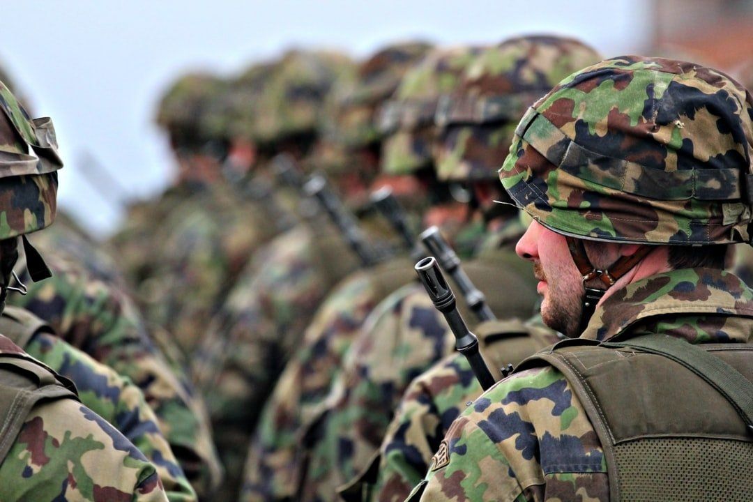 A group of soldiers are standing in a line.