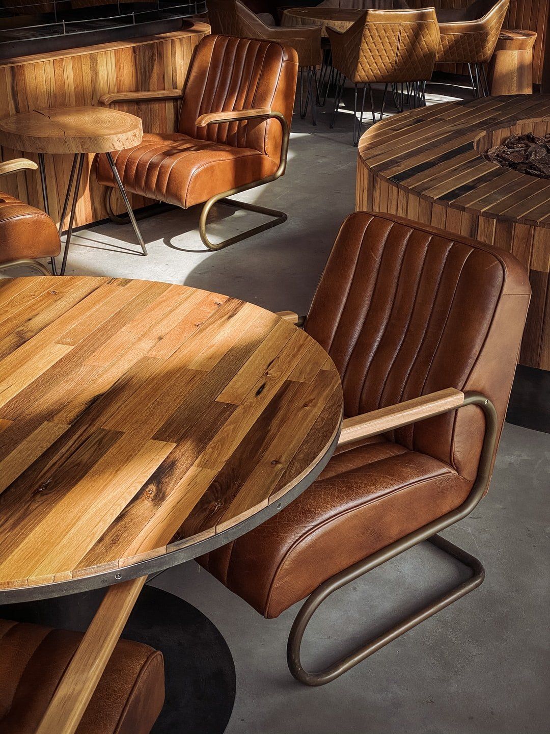 A room with wooden tables and chairs in it