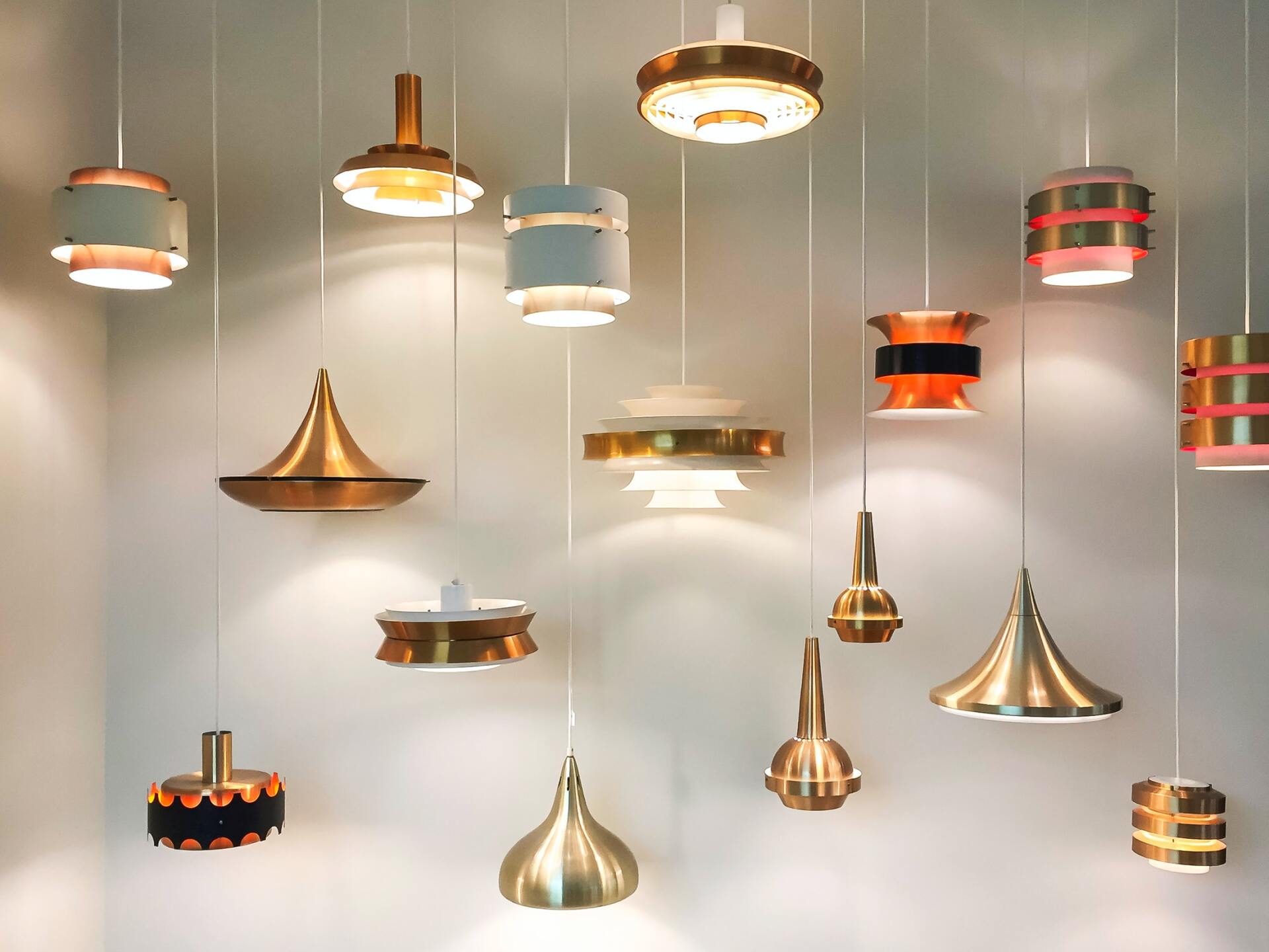 A bunch of pendant lights are hanging from the ceiling