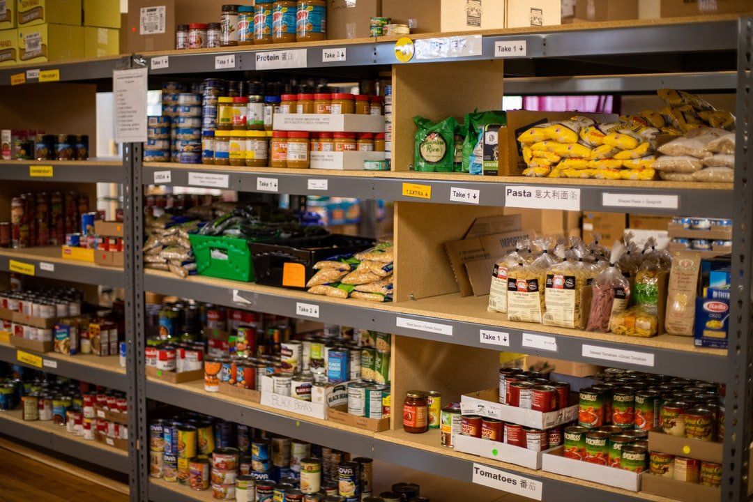 A warehouse filled with shelves filled with lots of food.