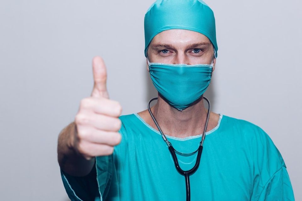Doctor giving thumbs up